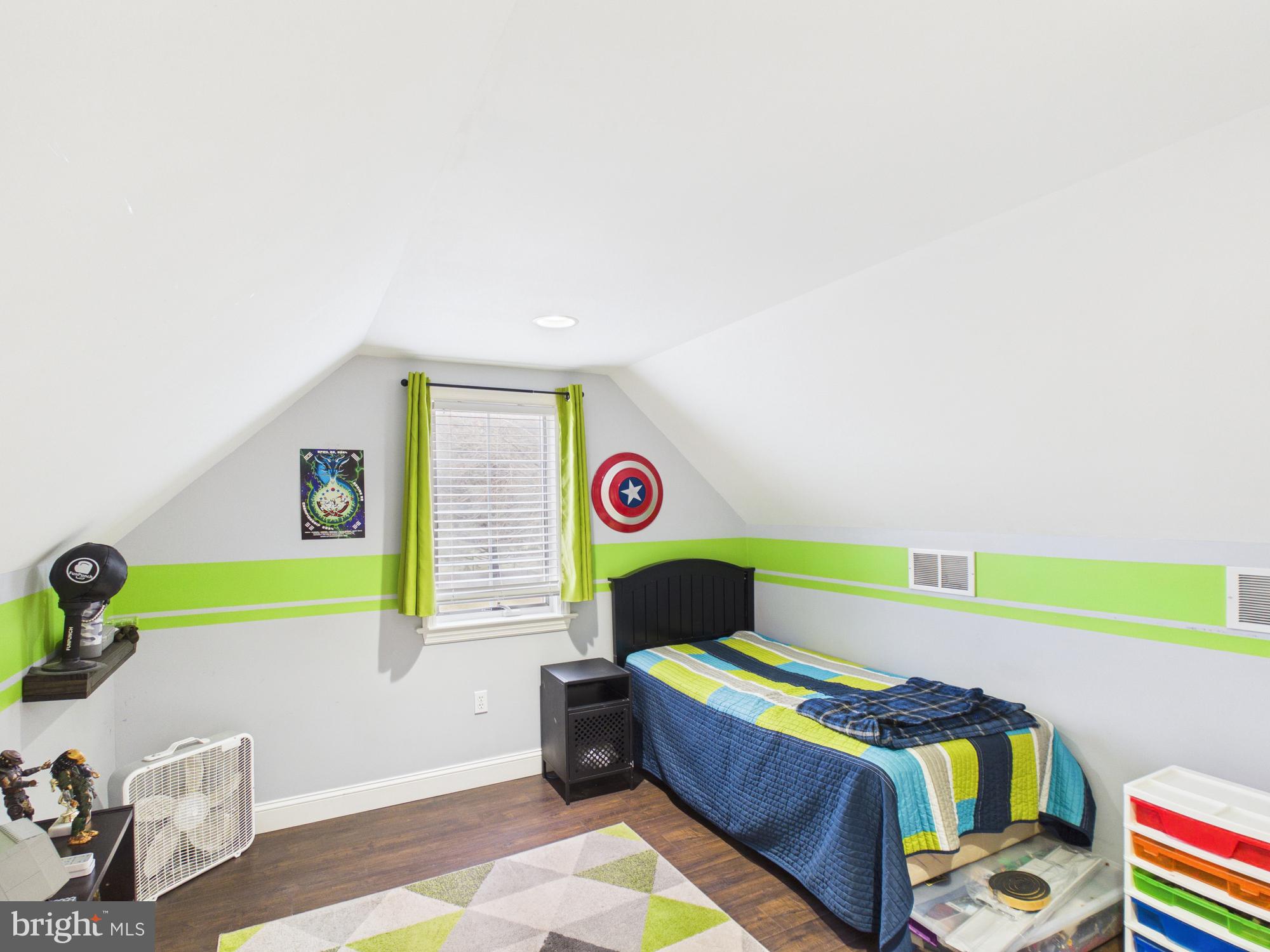 119 Saybrooke Drive Lititz, PA 17543 - Photo 33 of 40 a living room with a bed and a chair