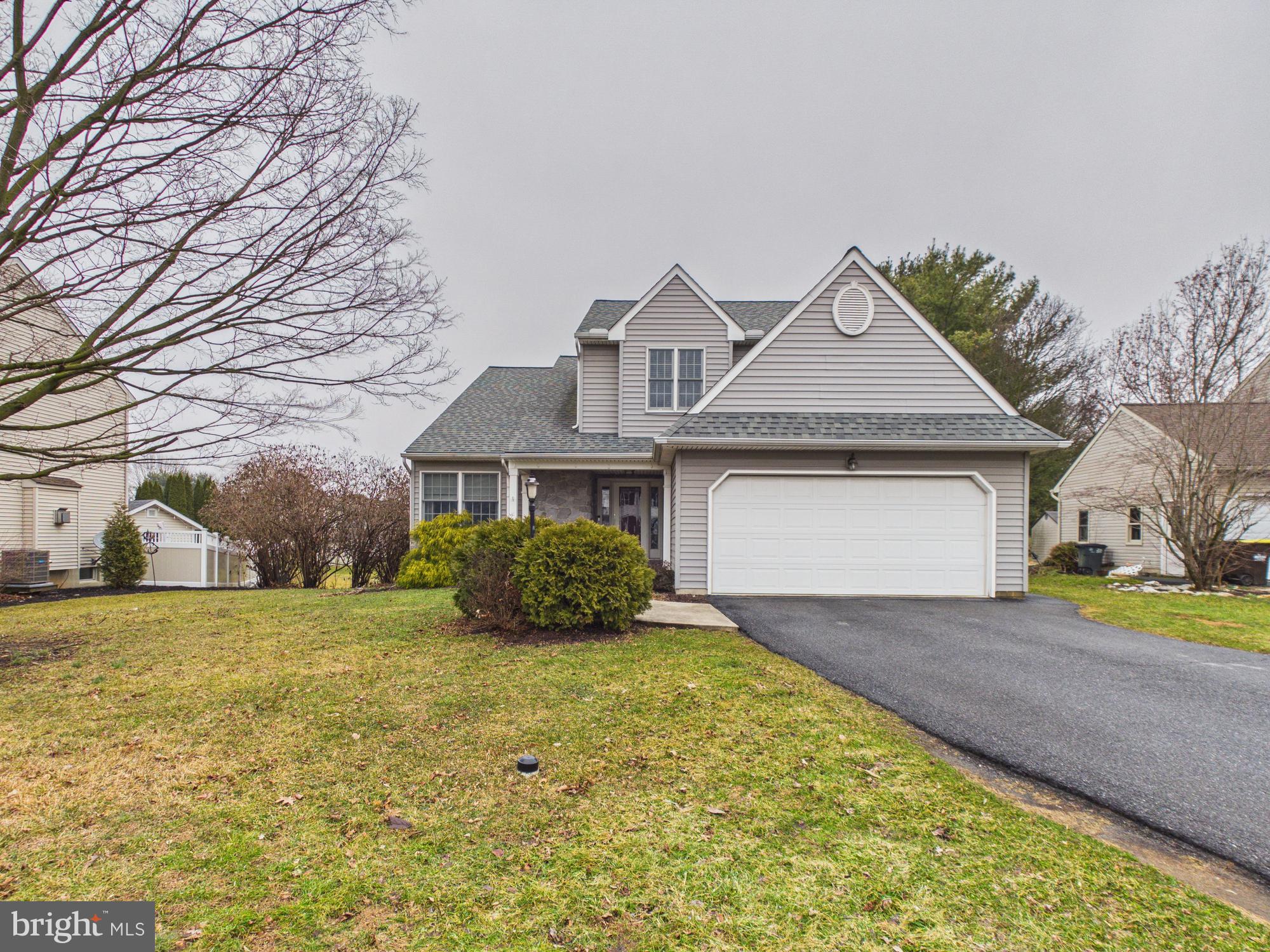 119 Saybrooke Drive Lititz, PA 17543 - Photo 4 of 40 a front view of a house with a yard and garage