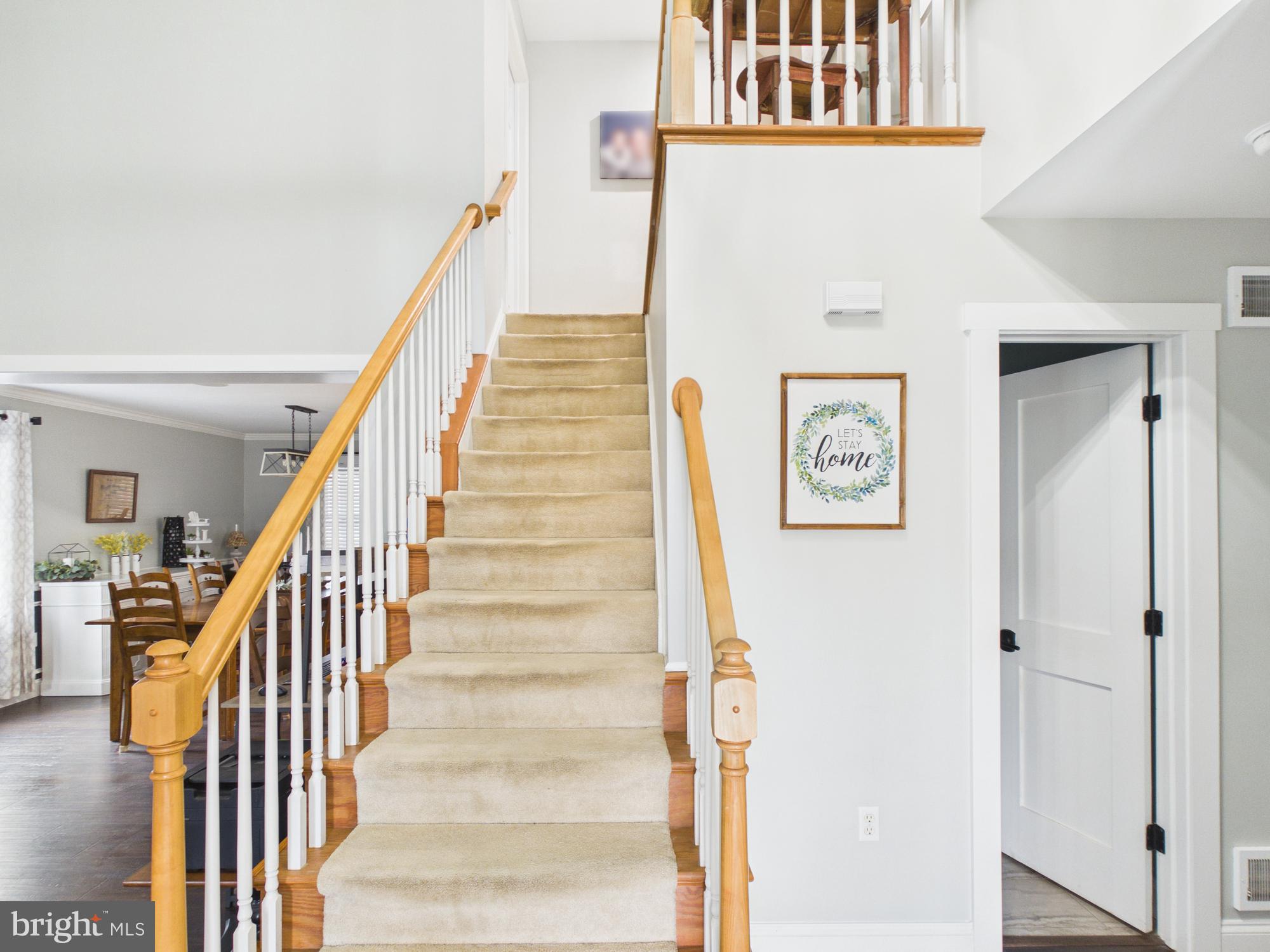 119 Saybrooke Drive Lititz, PA 17543 - Photo 6 of 40 a view of staircase with lots of frames on wall and a window