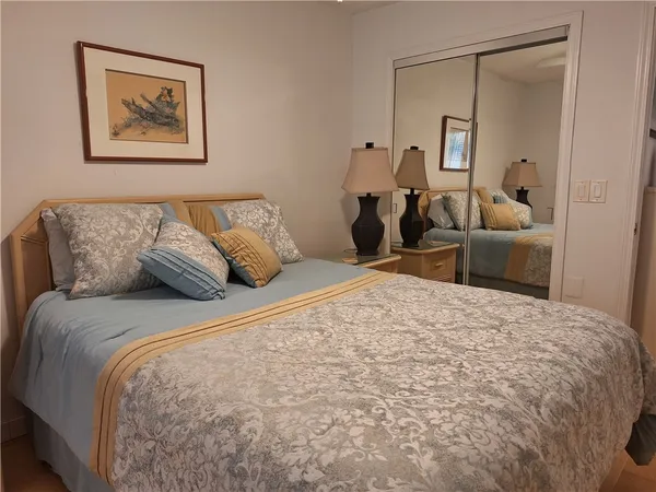 a bedroom with a bed and a couch