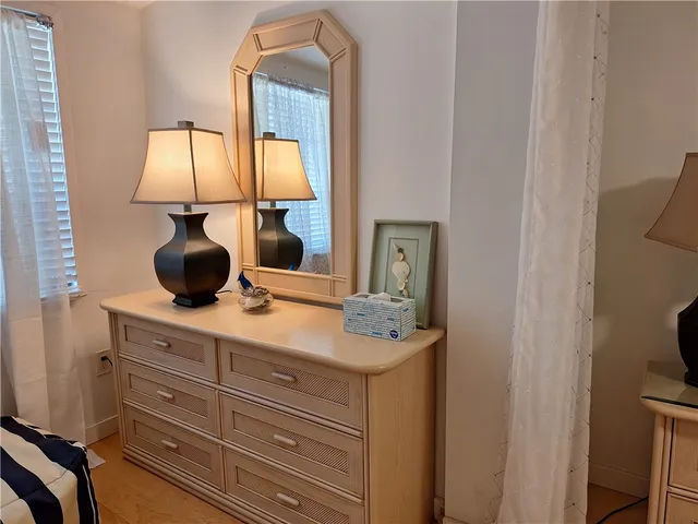 a bathroom with a sink vanity and a mirror