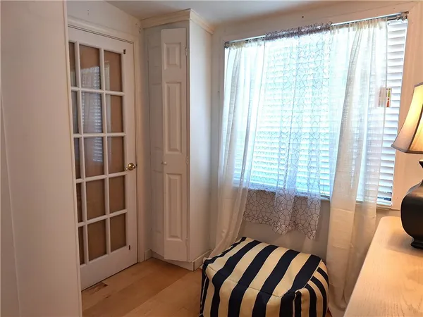 a view of an empty room with a window