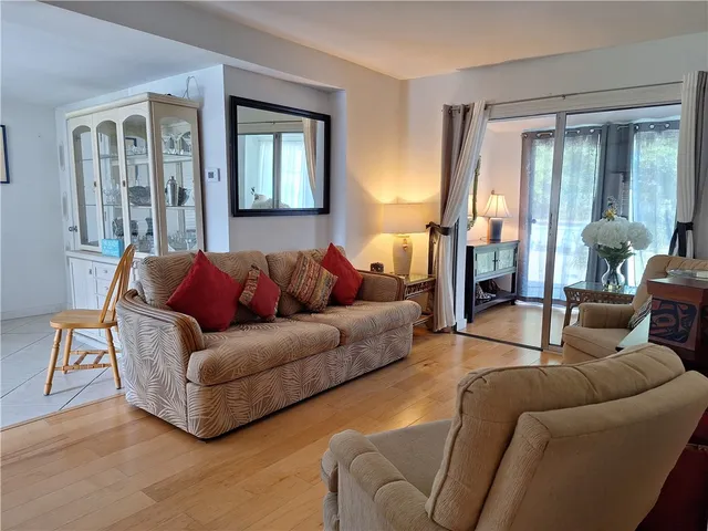 a living room with a couch and a window