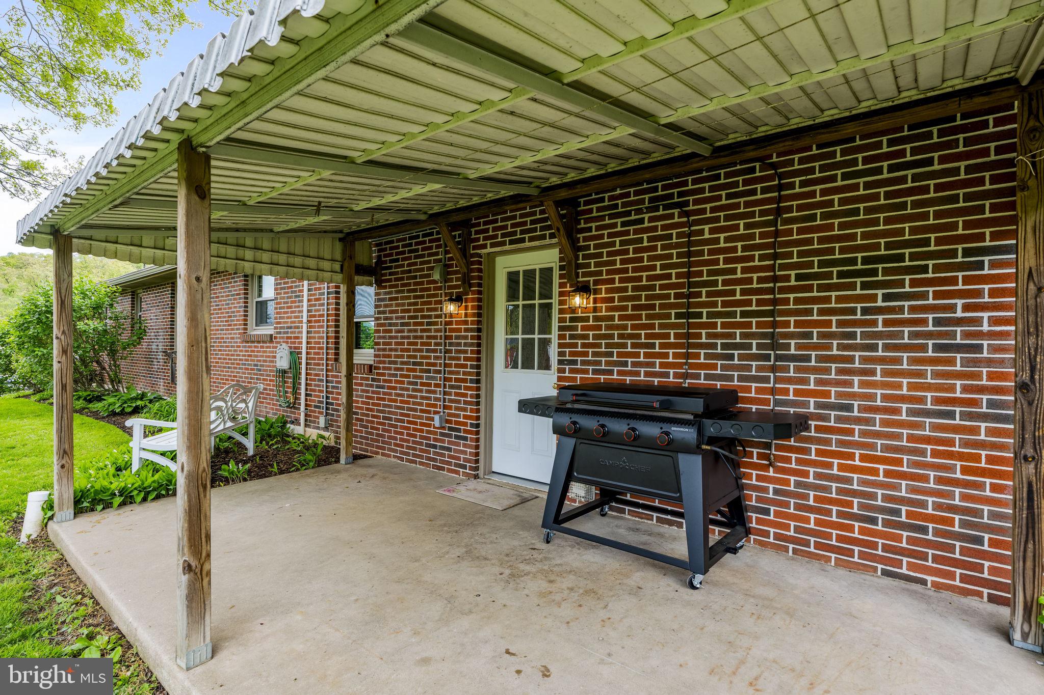 1160 Narvon Road Narvon, PA 17555 - Photo 15 of 64 a view of a patio with table and chairs and potted plants