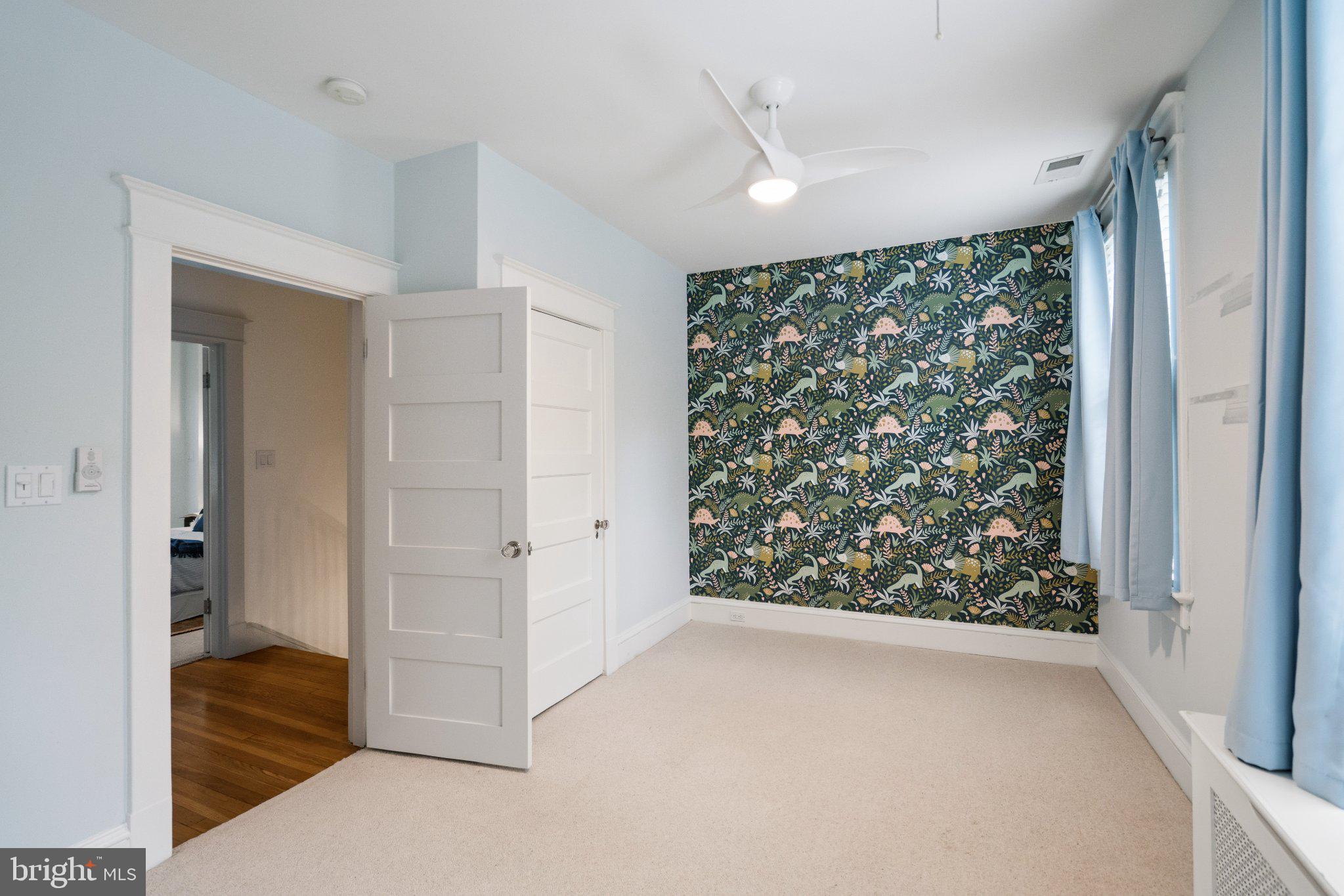 2934 Porter Street Northwest Washington, DC 20008 - Photo 24 of 33 Charming room with vibrant wallpaper.