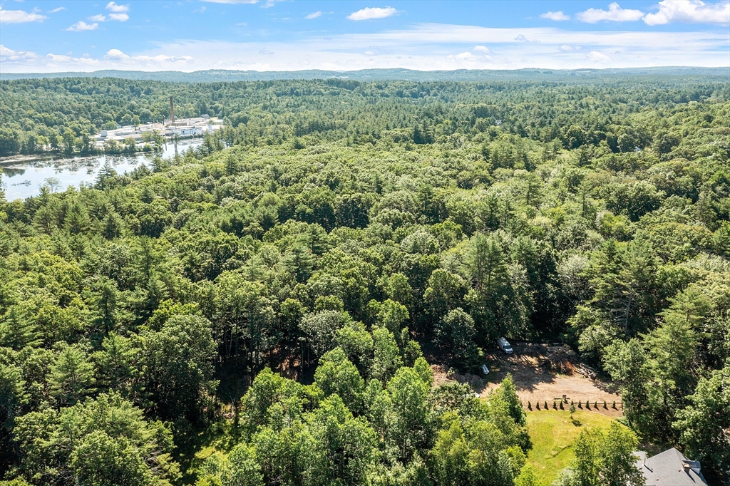 111 Squannacook Road Shirley, MA 01464 - Photo 7 of 9 a view of a city with lush green forest