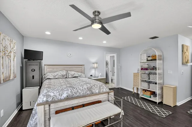 a living room with patio furniture and a floor to ceiling window