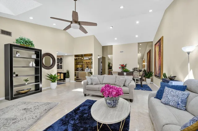 a kitchen with stainless steel appliances granite countertop a sink a stove and cabinets