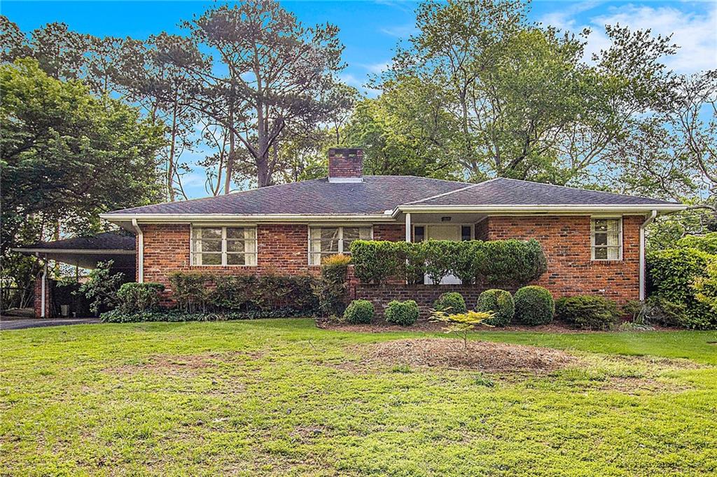 894 Nottingham Drive Avondale Estates, GA 30002 - Photo 1 of 1 a front view of house with yard and green space
