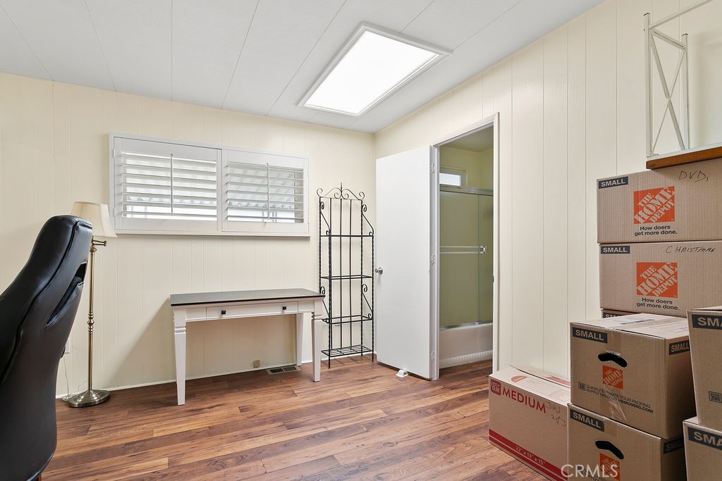 24921 Muirlands Boulevard, Unit 23 Lake Forest, CA 92630 - Photo 20 of 27 a view of cabinets and wooden floor