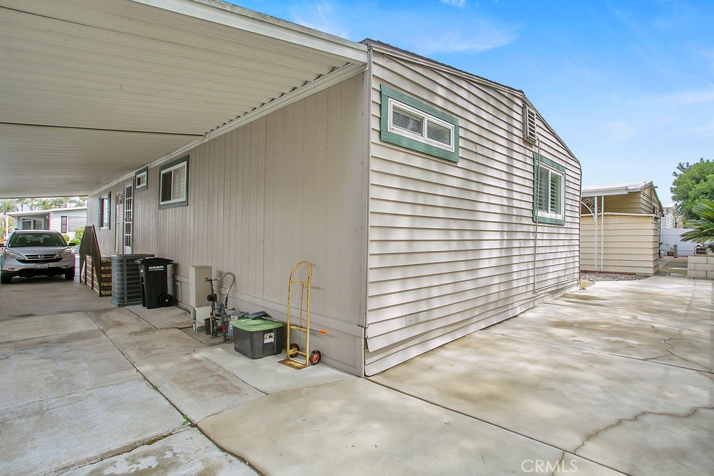 24921 Muirlands Boulevard, Unit 23 Lake Forest, CA 92630 - Photo 25 of 27 a view of a garage with parked cars