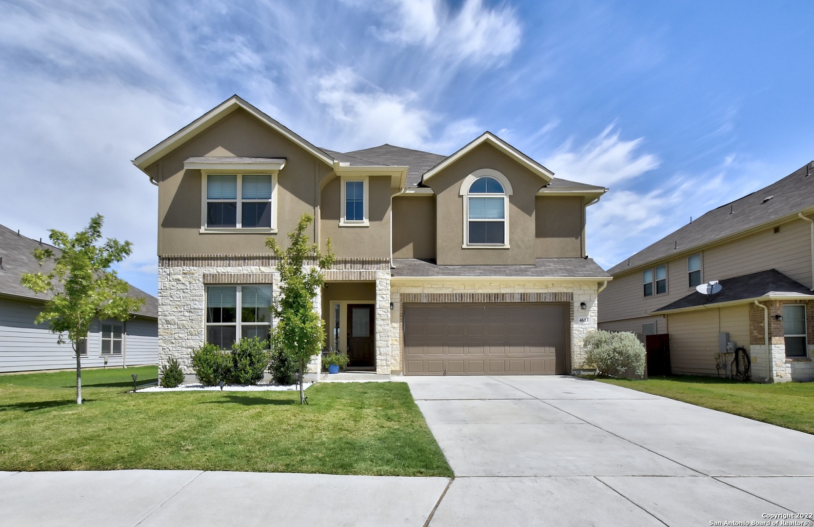4613 Falling Oak Cibolo, TX 78108 - Photo 1 of 1 a front view of a house with a yard and garage