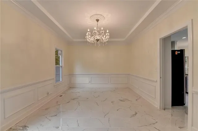 a view of a livingroom with a fireplace and large windows