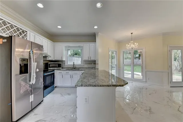 a view of an empty room and wooden floor