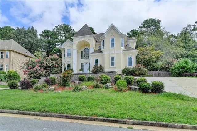 a view of the house with potted plants