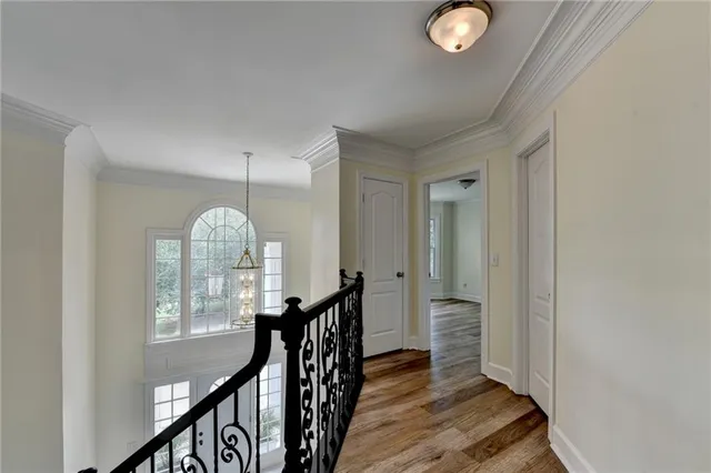 a view of balcony with wooden floor and fence