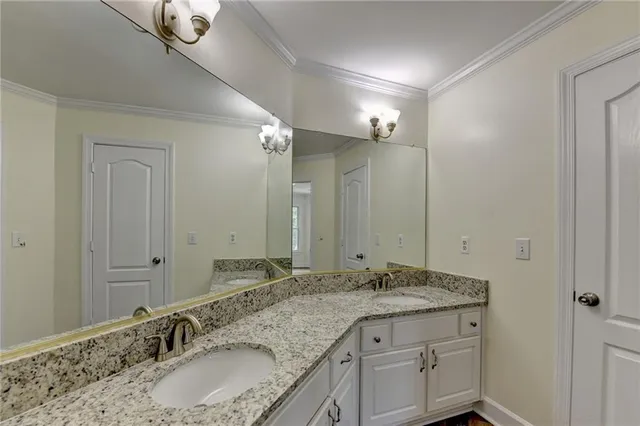 a kitchen with stainless steel appliances granite countertop a sink and a stove top oven with wooden floor