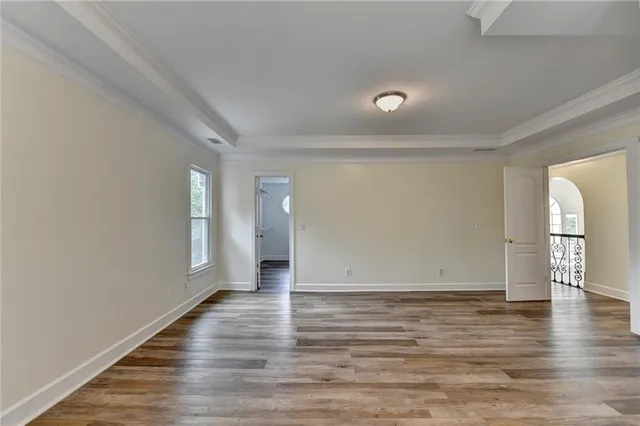 a view of a yard with a bench and trees