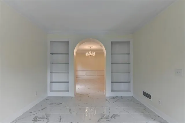 a kitchen with stainless steel appliances granite countertop a sink and a refrigerator