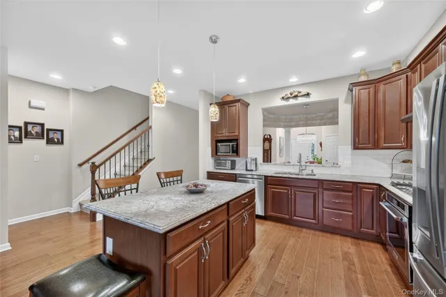 a living room with fireplace furniture and a wooden floor