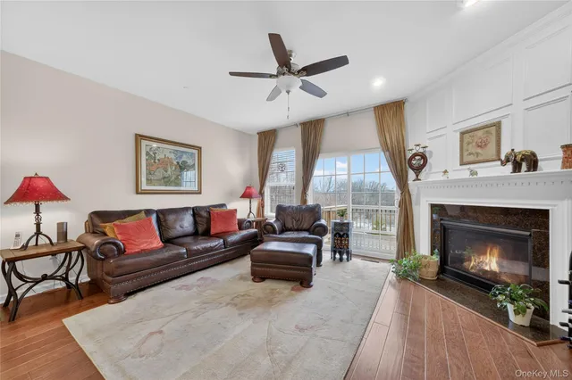 a kitchen with stainless steel appliances granite countertop a kitchen island a stove a sink and a refrigerator