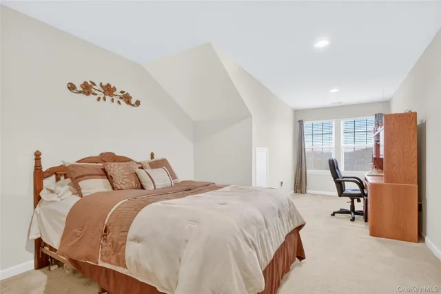 a living room with furniture and a lamp