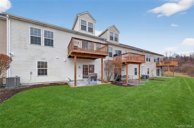 a view of a porch with a table and chairs