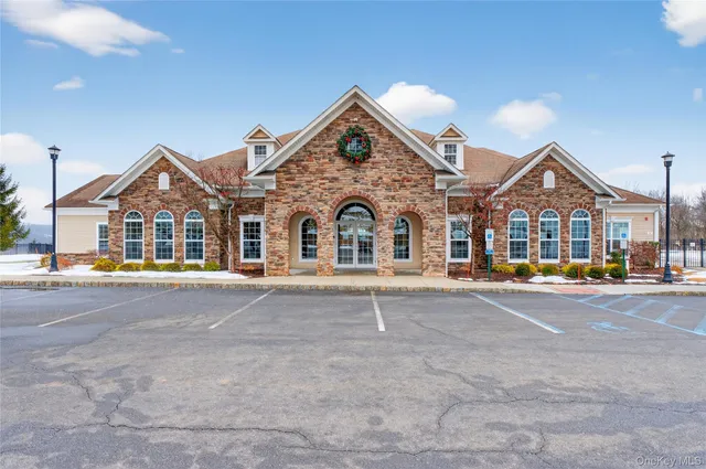 a view of a golf course with chairs