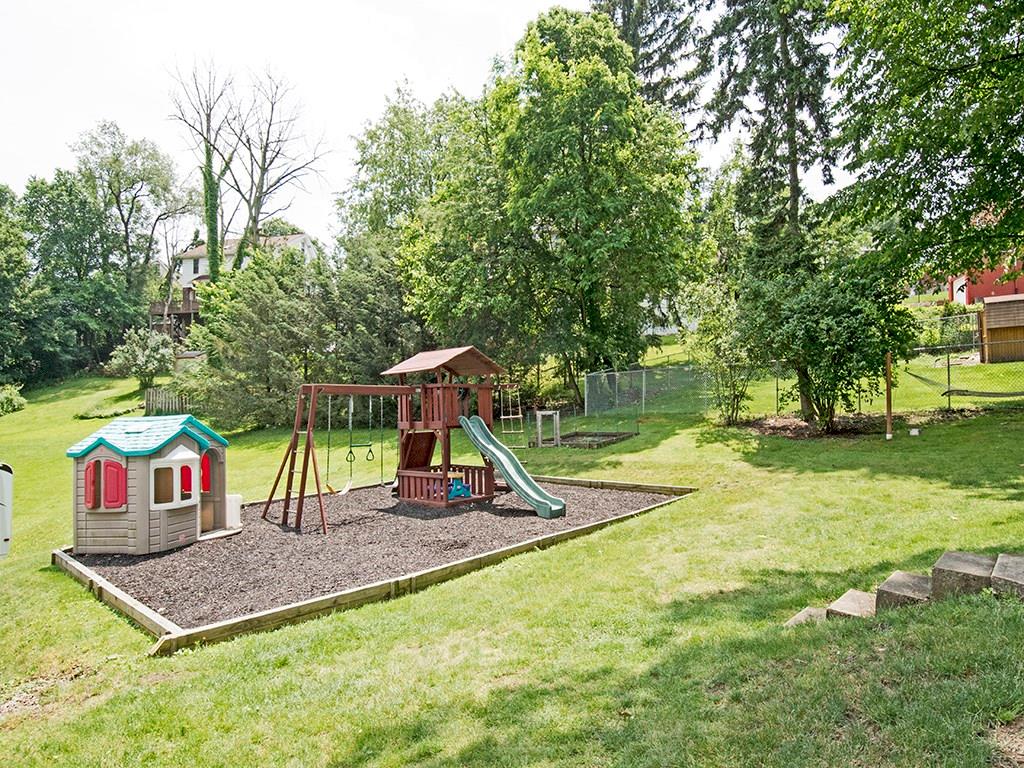 4480 Rodenbaugh Avenue Pittsburgh, PA 15214 - Photo 10 of 10 Mature and well-maintained level back yard with playset included. Spacious 1 car detached garage with additional parking space as well.