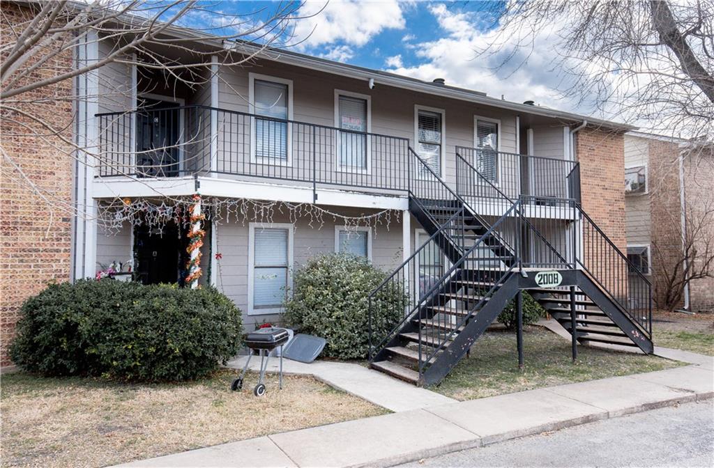 View of apartment building / complex featuring stairway