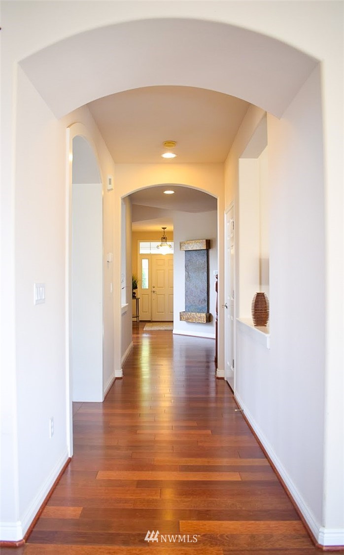1217 South 36th Place Renton, WA 98055 - Photo 2 of 15 a view of a hallway with wooden floor