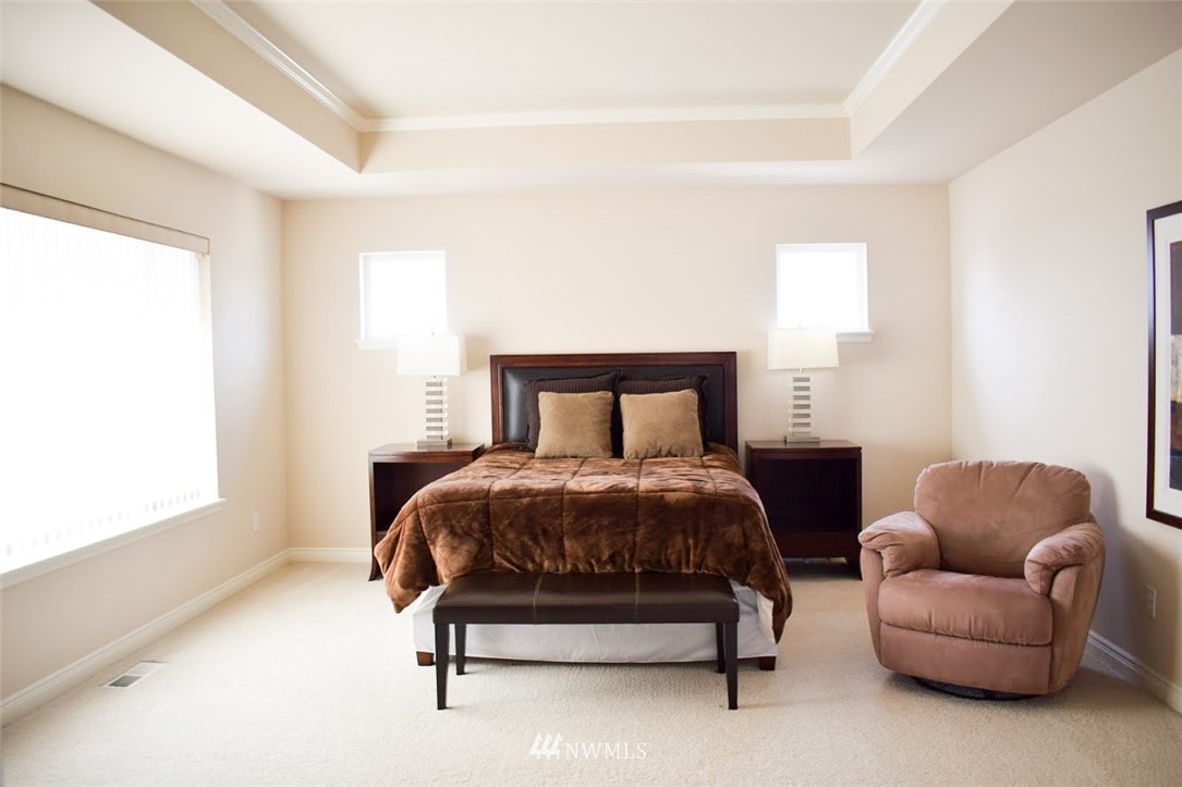 1217 South 36th Place Renton, WA 98055 - Photo 13 of 15 a bedroom with a bed couch and window