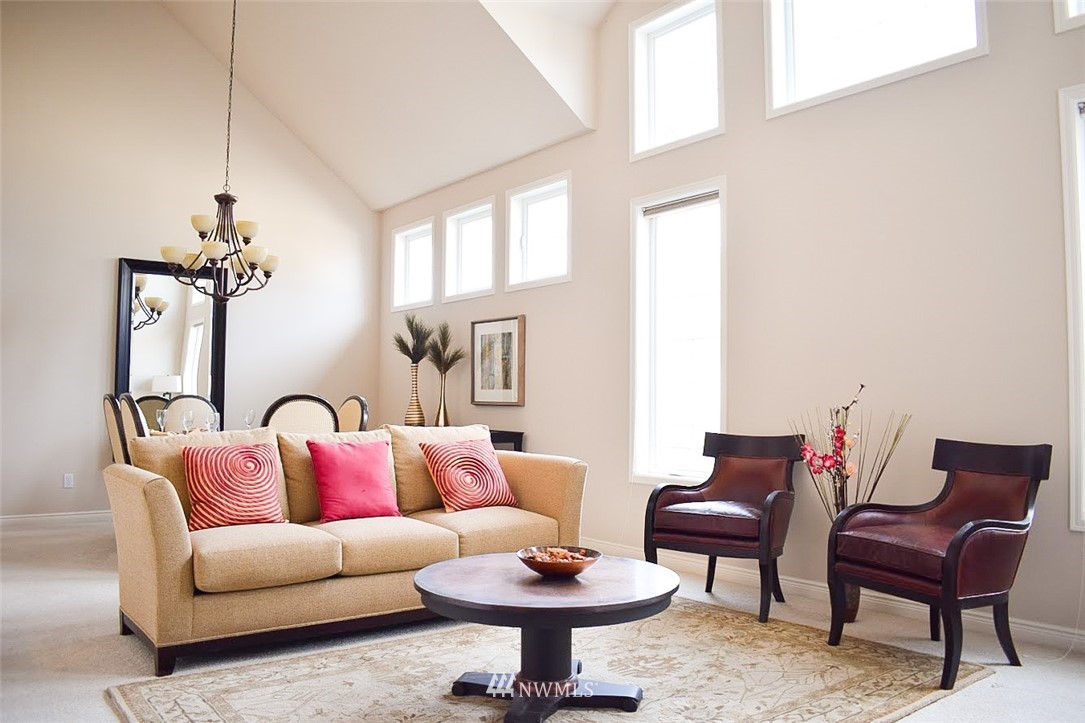 1217 South 36th Place Renton, WA 98055 - Photo 4 of 15 a living room with furniture a rug and a window