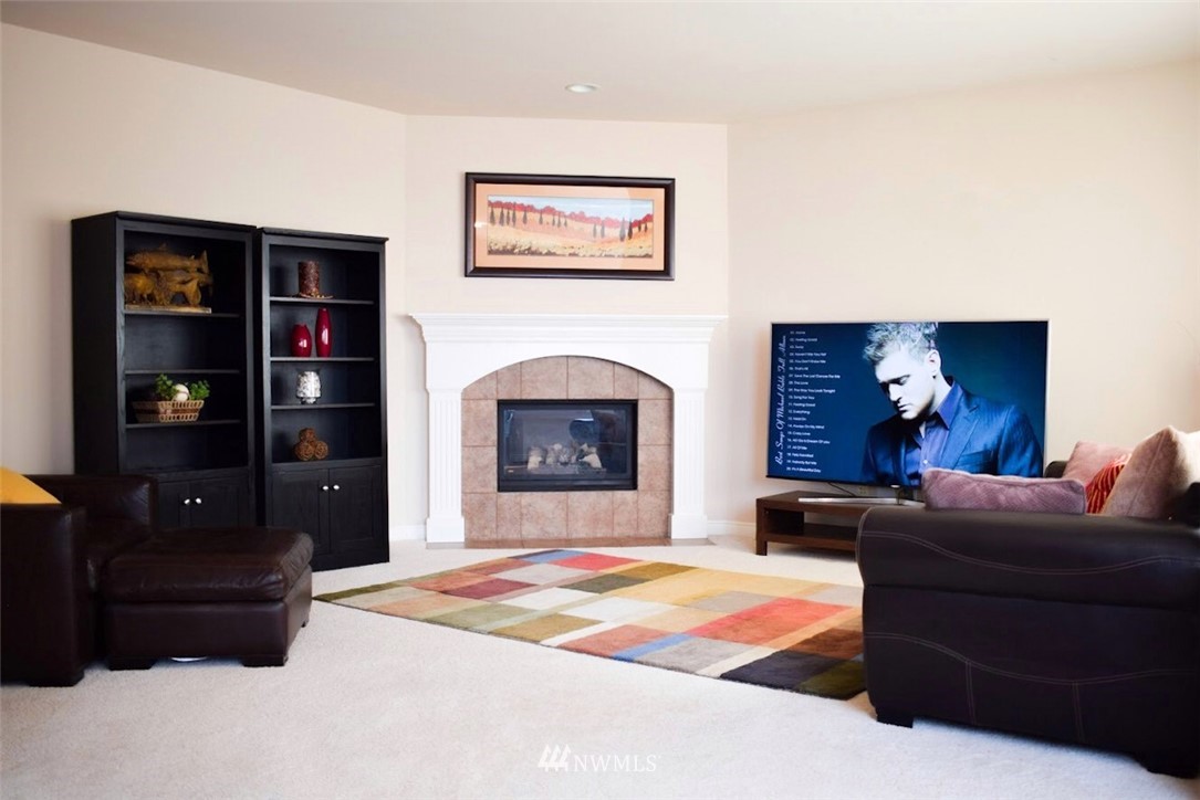 1217 South 36th Place Renton, WA 98055 - Photo 10 of 15 a living room with furniture and a fireplace