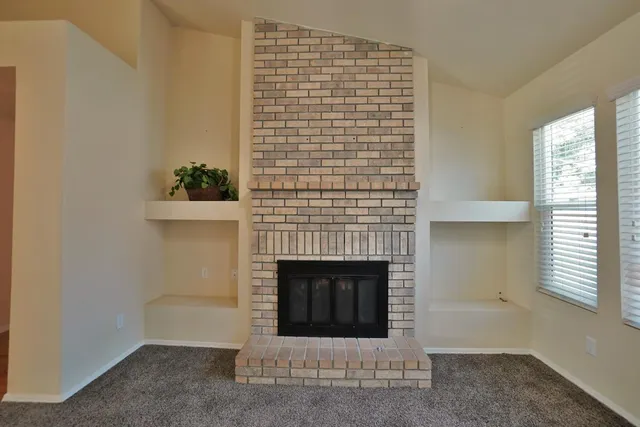 a view of a kitchen with wooden floor and a sink