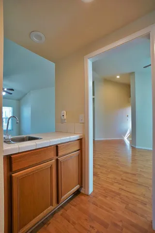 a kitchen with a stove a sink and a refrigerator