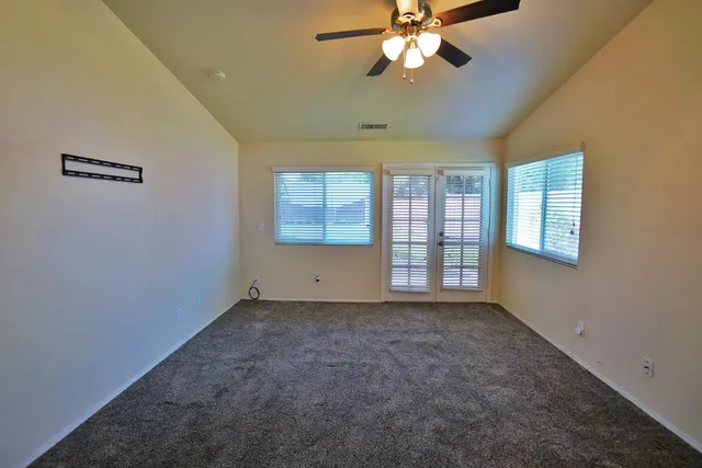 a bathroom with a double vanity sink a mirror and a bathtub
