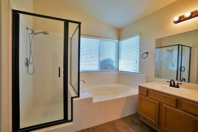 a view of backyard with a garden and plants