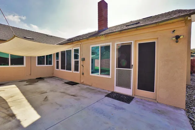a view of a house with a yard and plants