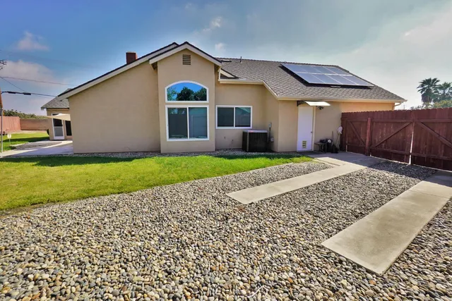a view of a backyard with a patio