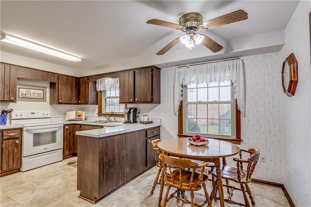 201 Calvin Drive McKees Rocks, PA 15136 - Photo 6 of 22 The kitchen includes a breakfast area with ceiling fan light.