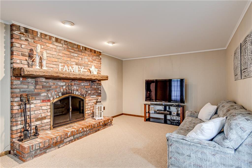 201 Calvin Drive McKees Rocks, PA 15136 - Photo 7 of 22 The family room offers a log burning fireplace.