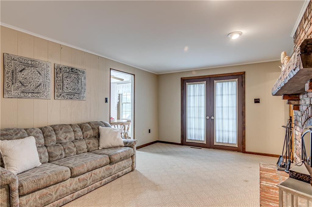 201 Calvin Drive McKees Rocks, PA 15136 - Photo 8 of 22 The family room includes doors that lead to the patio.