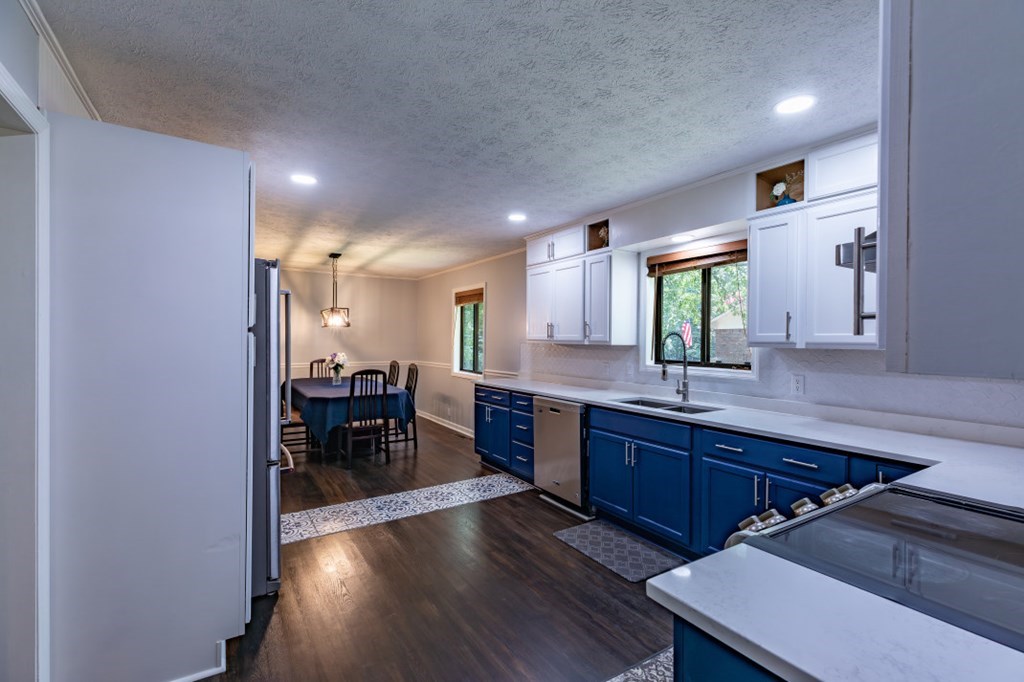 94 Brer Rabbit Trail Jasper, GA 30143 - Photo 13 of 37 a large kitchen with lots of counter space a sink and chairs