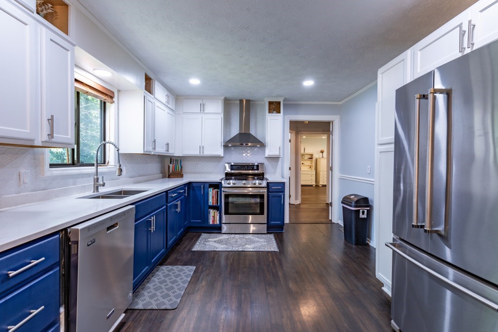 94 Brer Rabbit Trail Jasper, GA 30143 - Photo 16 of 37 a kitchen with granite countertop a refrigerator stove and sink