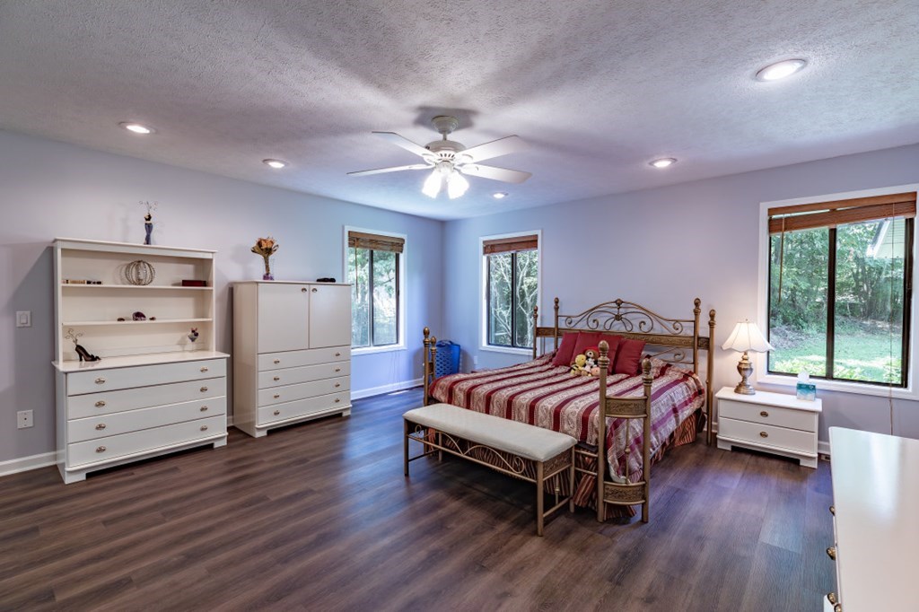 94 Brer Rabbit Trail Jasper, GA 30143 - Photo 19 of 37 a spacious bedroom with a bed and a large window