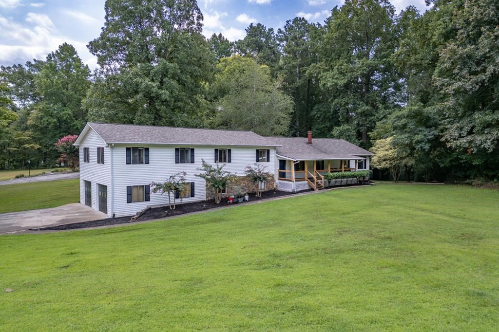 94 Brer Rabbit Trail Jasper, GA 30143 - Photo 2 of 37 a aerial view of a house with swimming pool and porch with green space