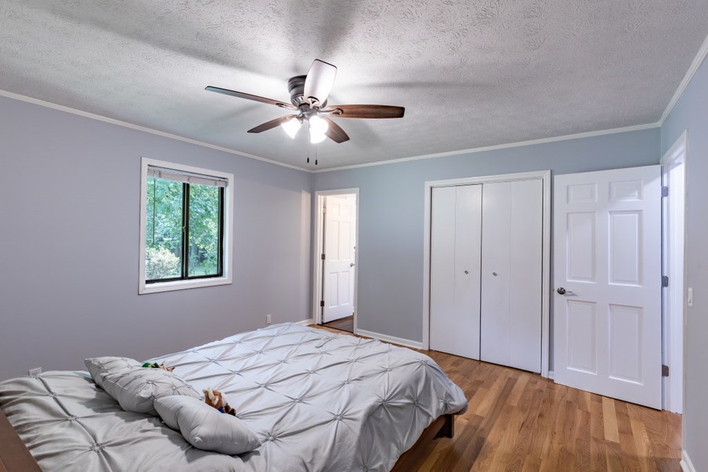94 Brer Rabbit Trail Jasper, GA 30143 - Photo 27 of 37 a bedroom with a large bed and a window