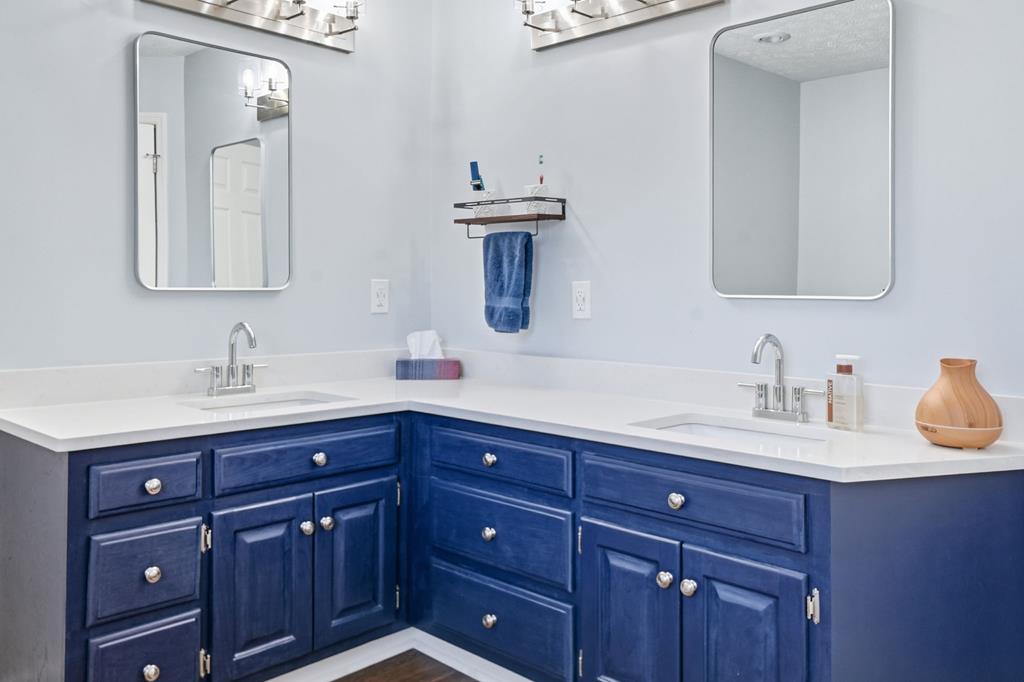 94 Brer Rabbit Trail Jasper, GA 30143 - Photo 39 of 54 a bathroom with a granite countertop sink and a mirror