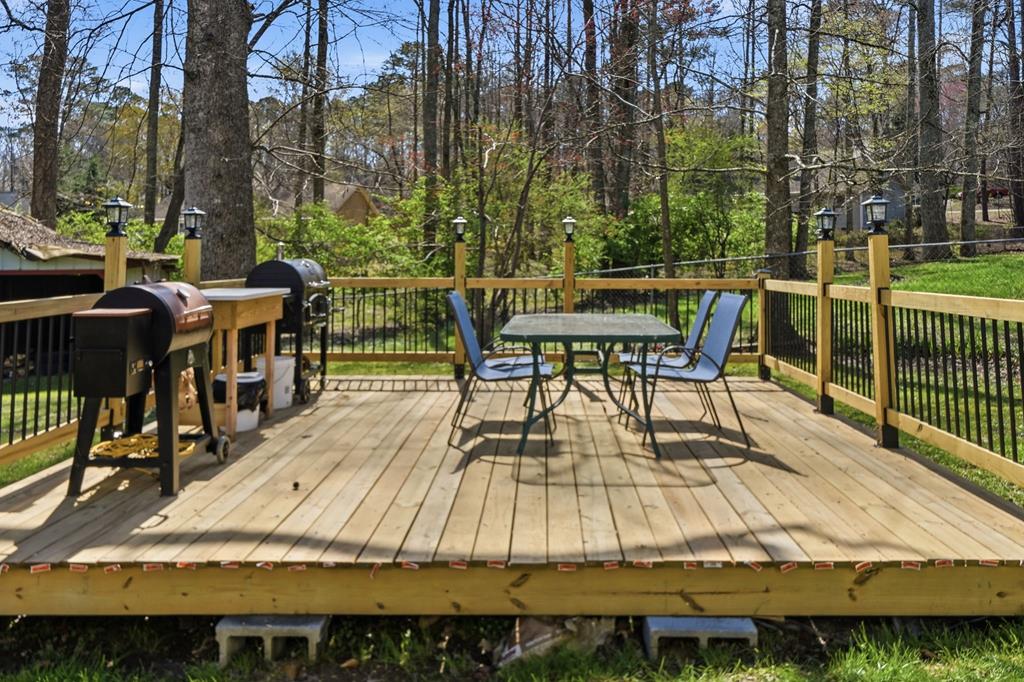 94 Brer Rabbit Trail Jasper, GA 30143 - Photo 49 of 54 a view of a chairs and table on the wooden deck